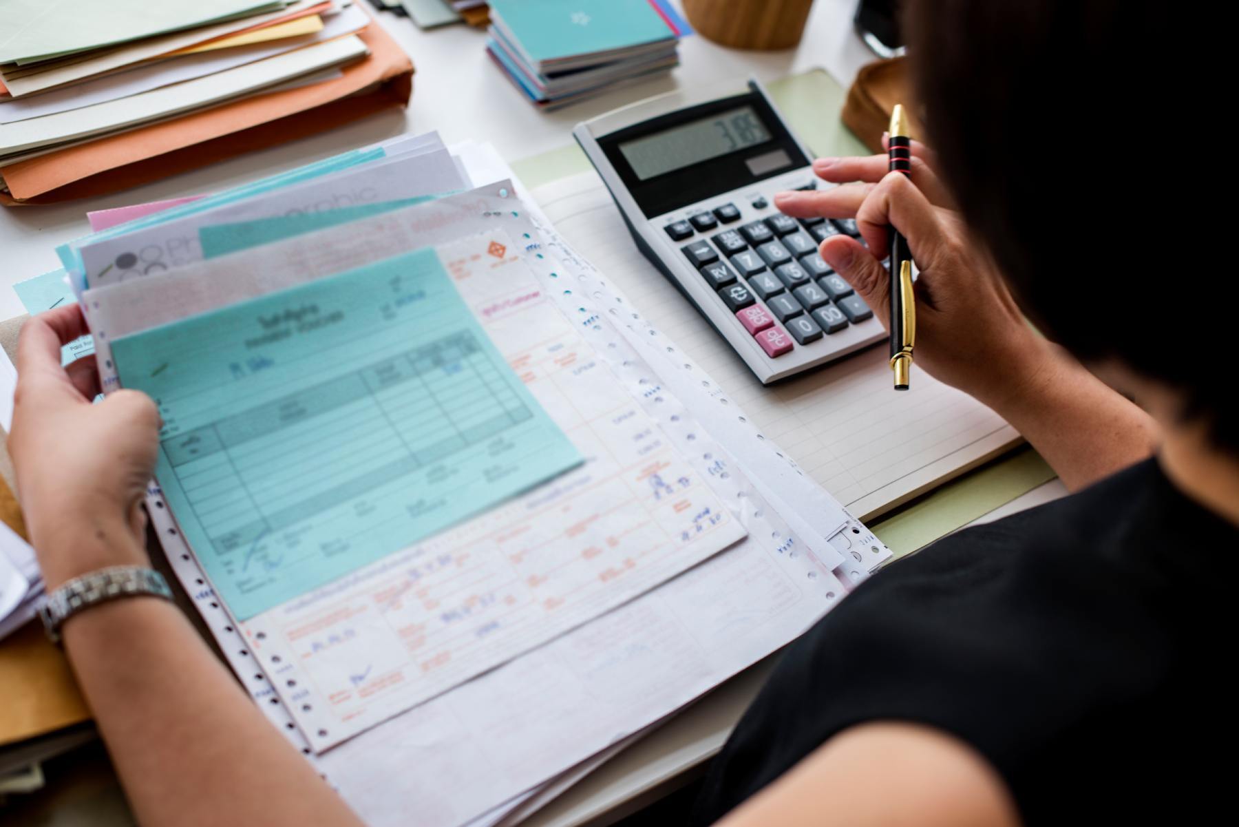 asian-woman-working-through-paperwork-1