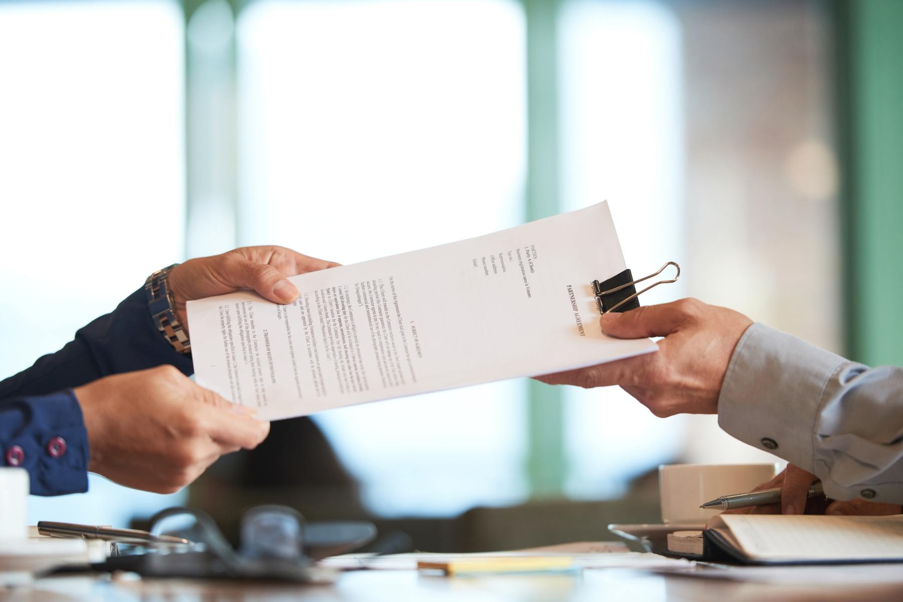 closeup-hands-passing-contract-unrecognizable-businessman (2)